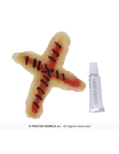 Cicatriz cruz suturada + adhesivo latex 2