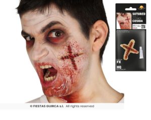 Cicatriz cruz suturada + adhesivo latex