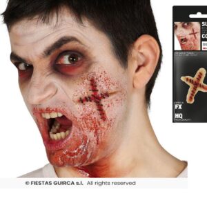 Cicatriz cruz suturada + adhesivo latex